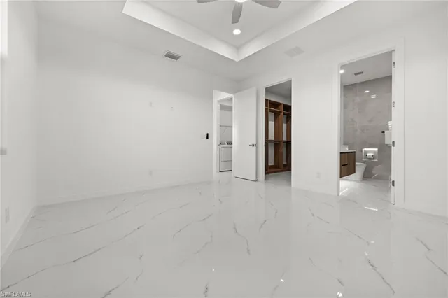 a bathroom with a toilet a sink and a mirror