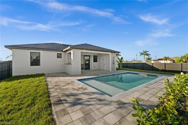 a view of a house with swimming pool