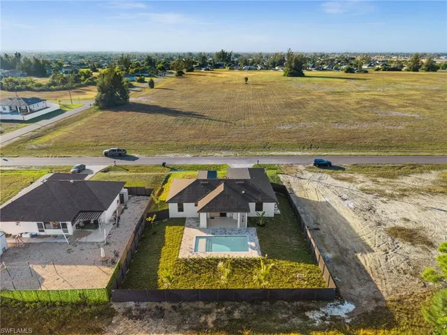 an aerial view of residential building and ocean