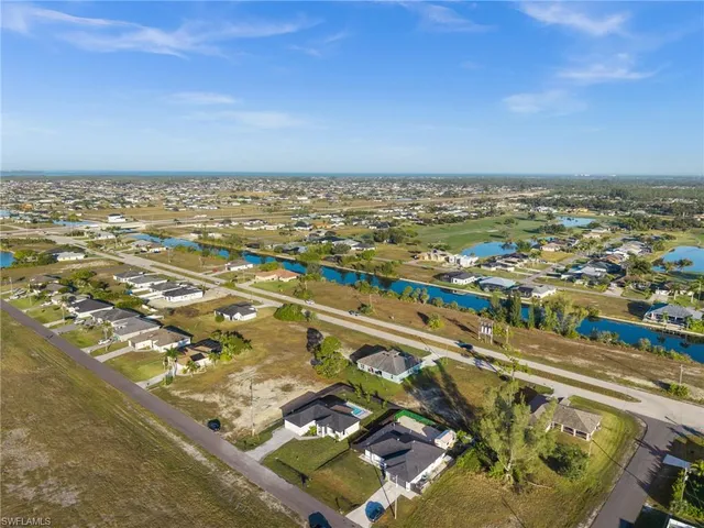 aerial view of a house with a yard