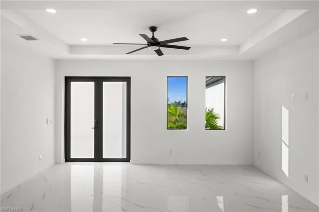 an empty room with windows and closet