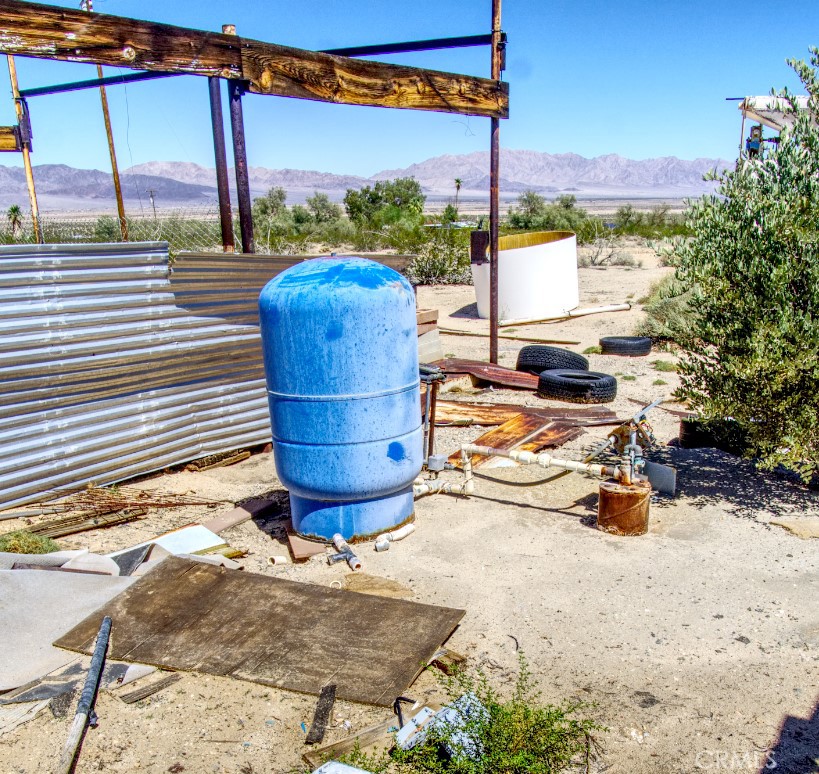 80422 Baseline Road Twentynine Palms, CA 92277 - Photo 11 of 30 a view of a swimming pool with a lounge chairs