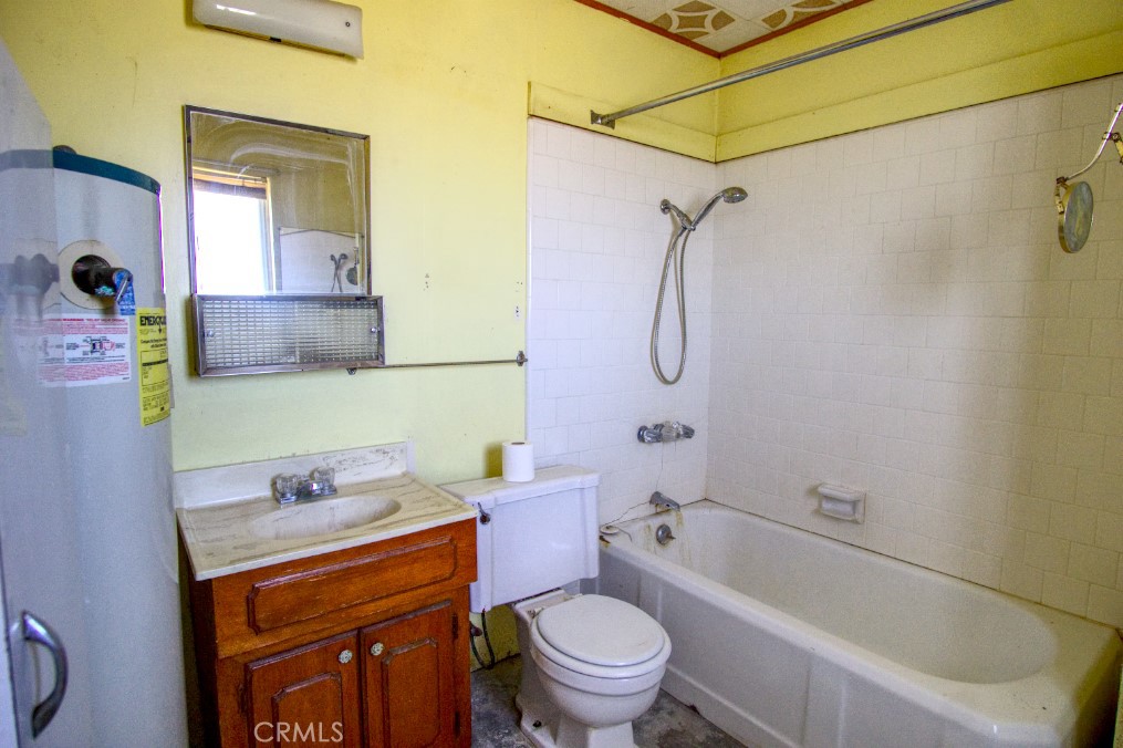 80422 Baseline Road Twentynine Palms, CA 92277 - Photo 24 of 30 a bathroom with a granite countertop toilet sink and shower