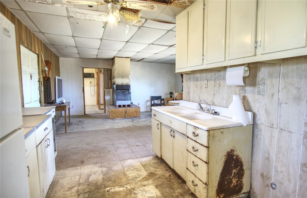 80422 Baseline Road Twentynine Palms, CA 92277 - Photo 25 of 30 a utility room with stainless steel appliances granite countertop a sink and cabinets