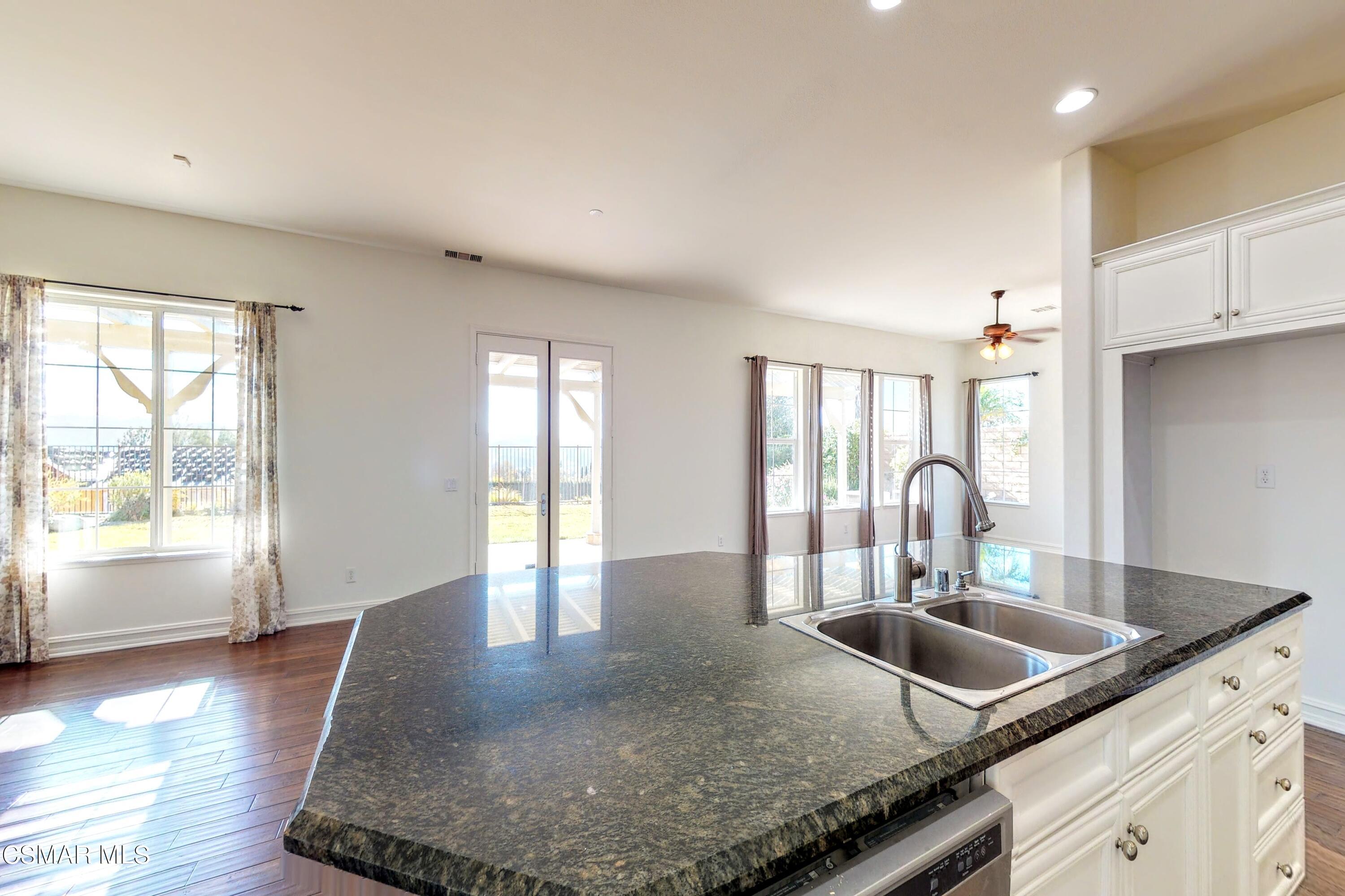 3705 Horizon Ridge Court Simi Valley, CA 93063 - Photo 13 of 62 a kitchen with granite countertop a sink a stove and cabinets