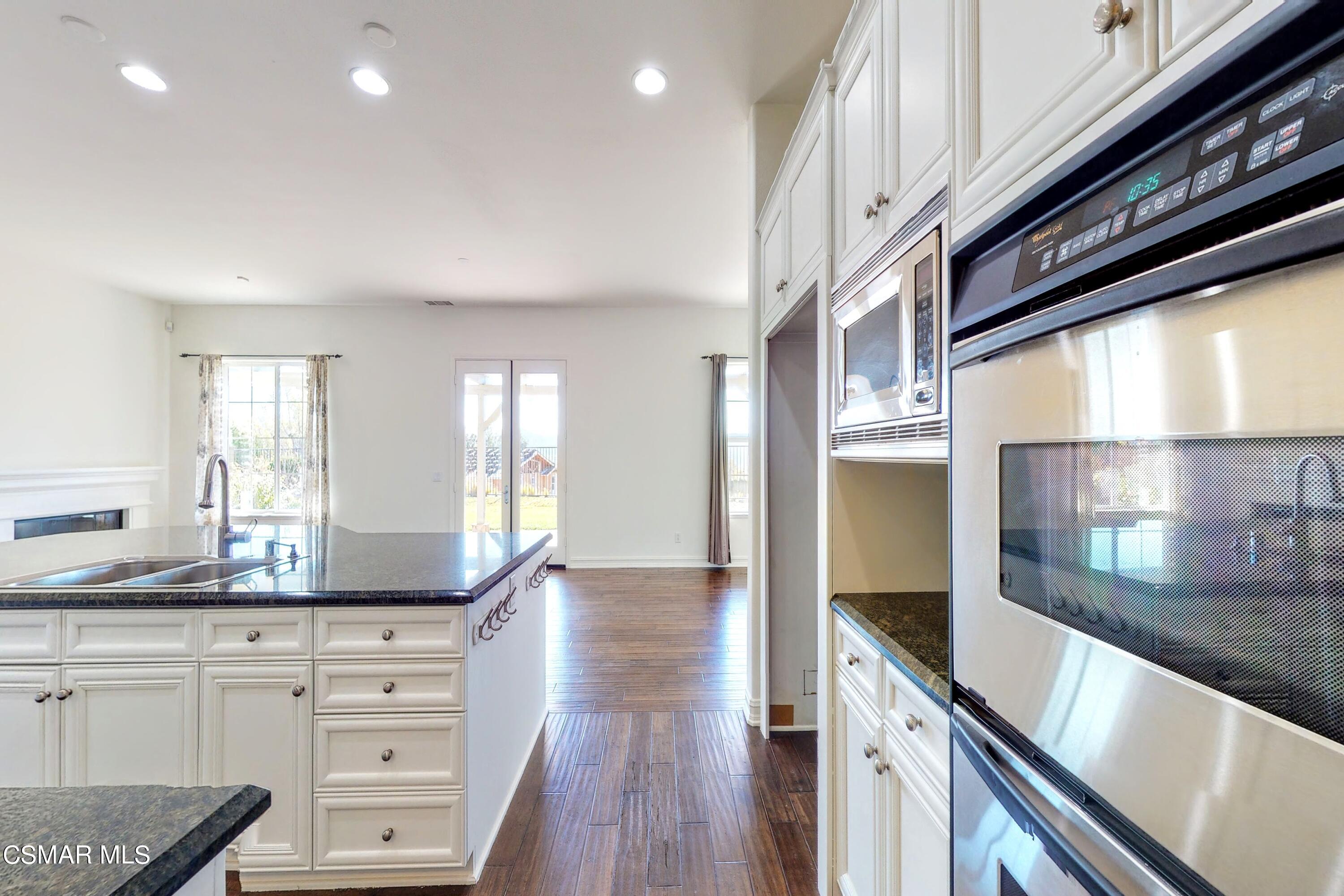 3705 Horizon Ridge Court Simi Valley, CA 93063 - Photo 16 of 62 a kitchen with granite countertop a sink cabinets and stainless steel appliances