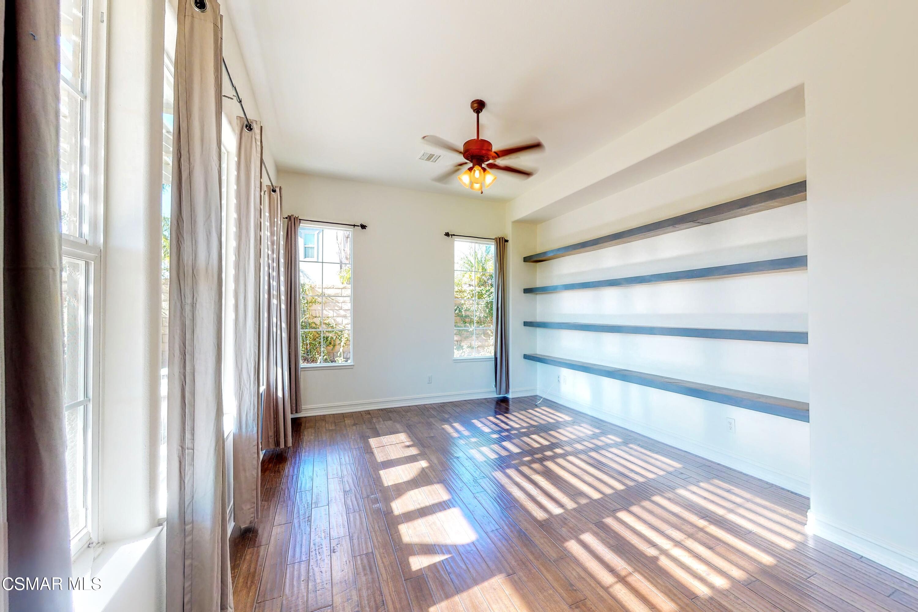 3705 Horizon Ridge Court Simi Valley, CA 93063 - Photo 18 of 62 a view of a room with wooden floor and chandelier