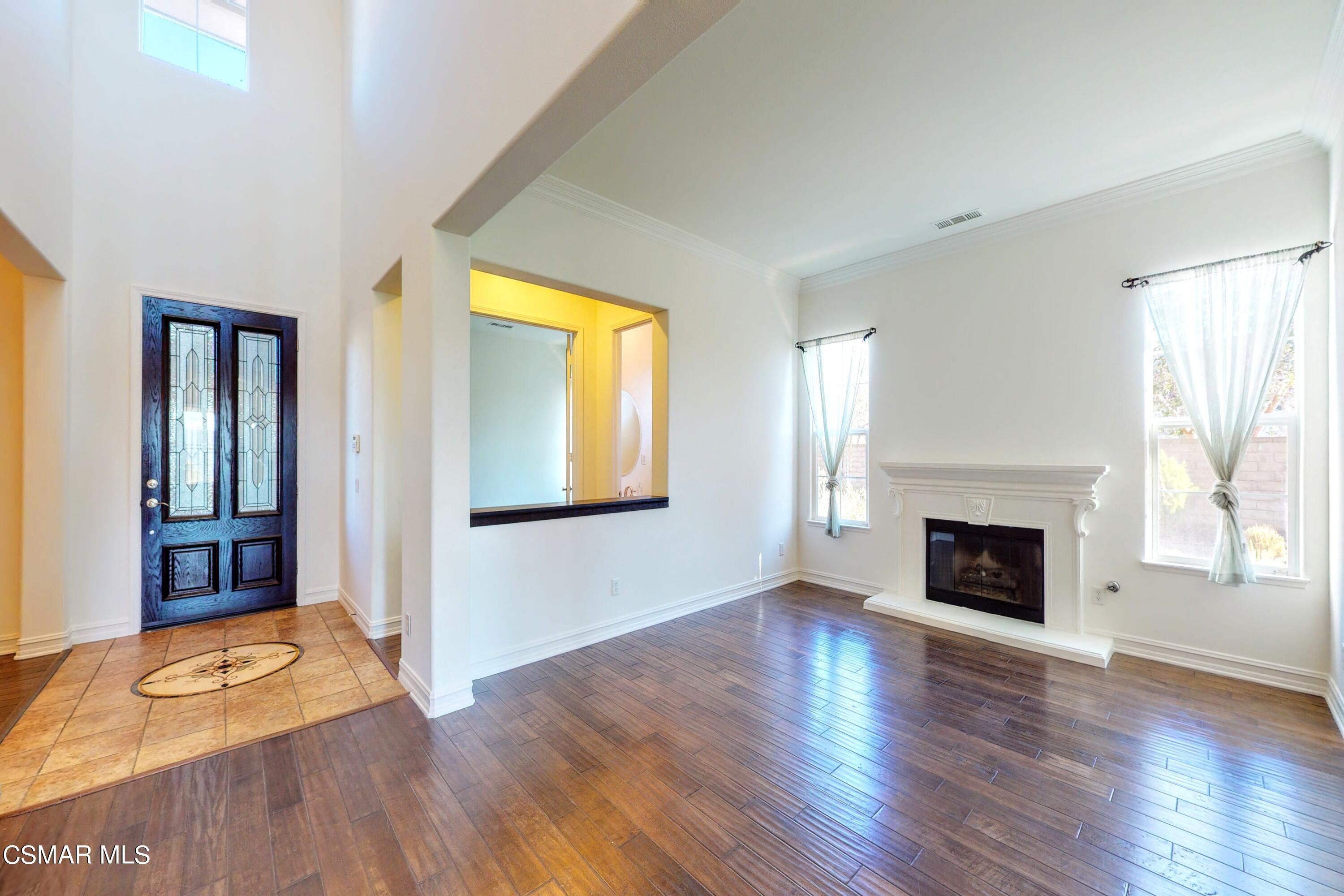 3705 Horizon Ridge Court Simi Valley, CA 93063 - Photo 24 of 62 an empty room with wooden floor fireplace and windows