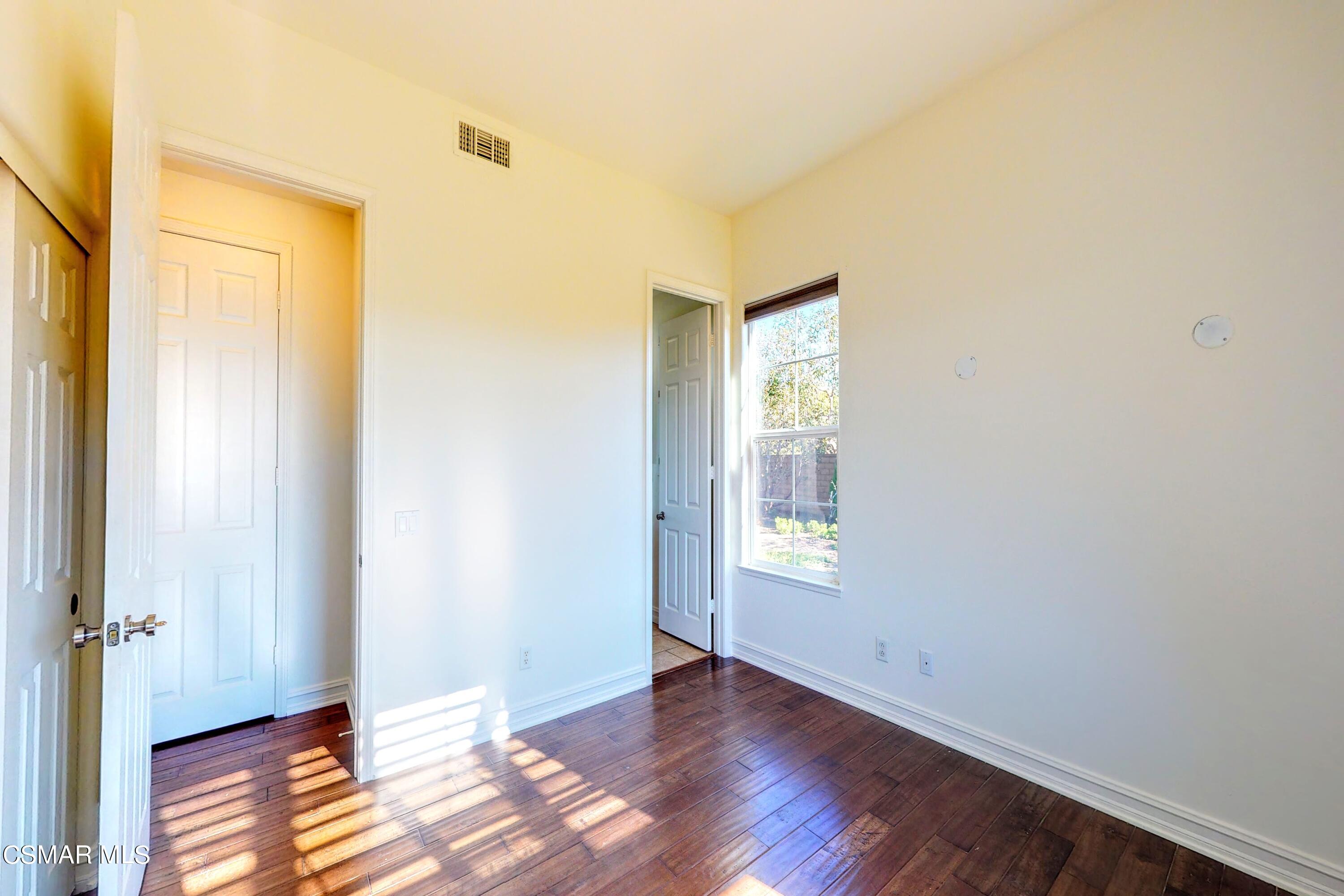 3705 Horizon Ridge Court Simi Valley, CA 93063 - Photo 27 of 62 a view of an empty room with wooden floor and a window