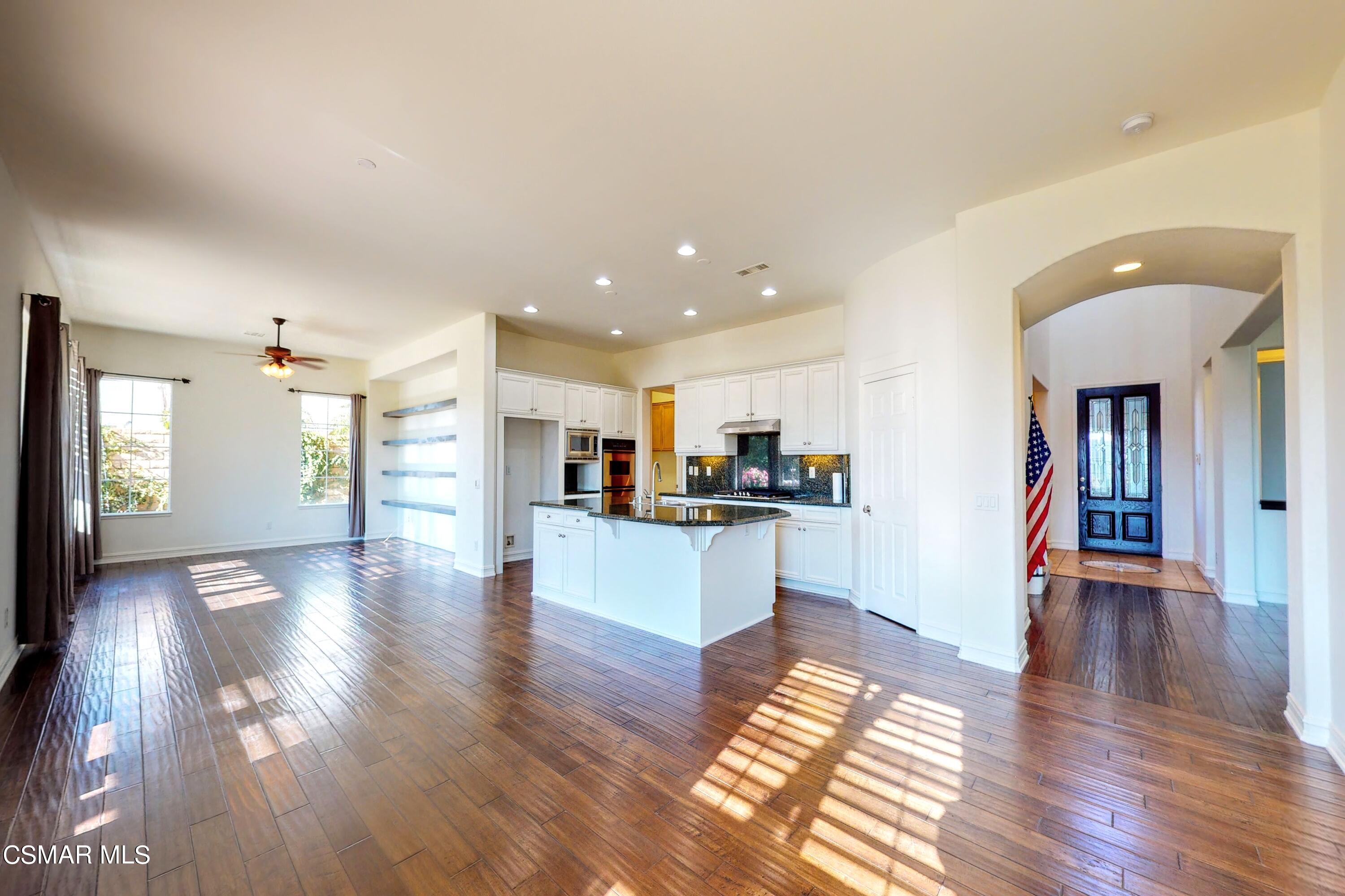 3705 Horizon Ridge Court Simi Valley, CA 93063 - Photo 28 of 62 a view of a kitchen with kitchen island wooden floor and center island