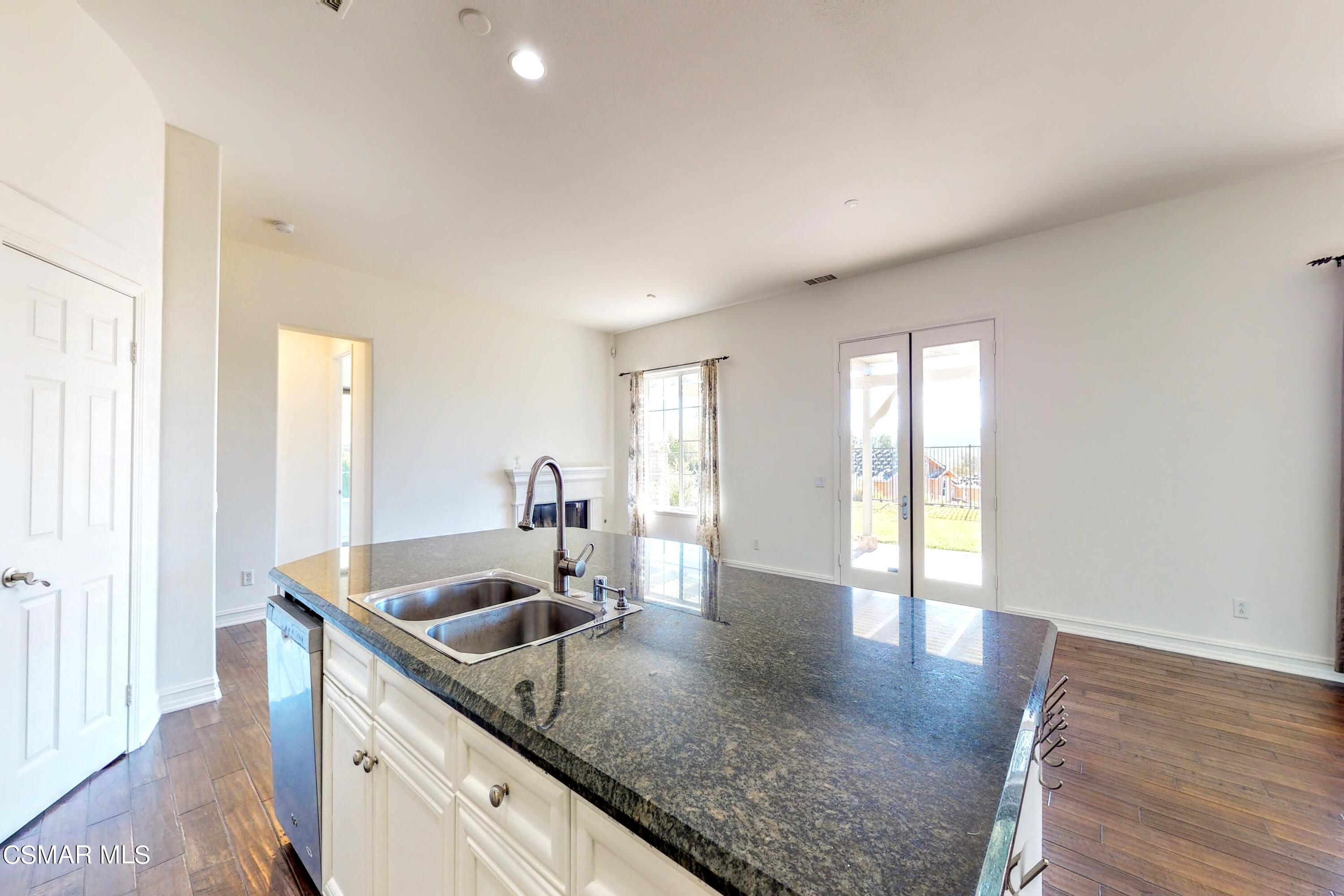 3705 Horizon Ridge Court Simi Valley, CA 93063 - Photo 31 of 62 a kitchen with granite countertop a sink and a window