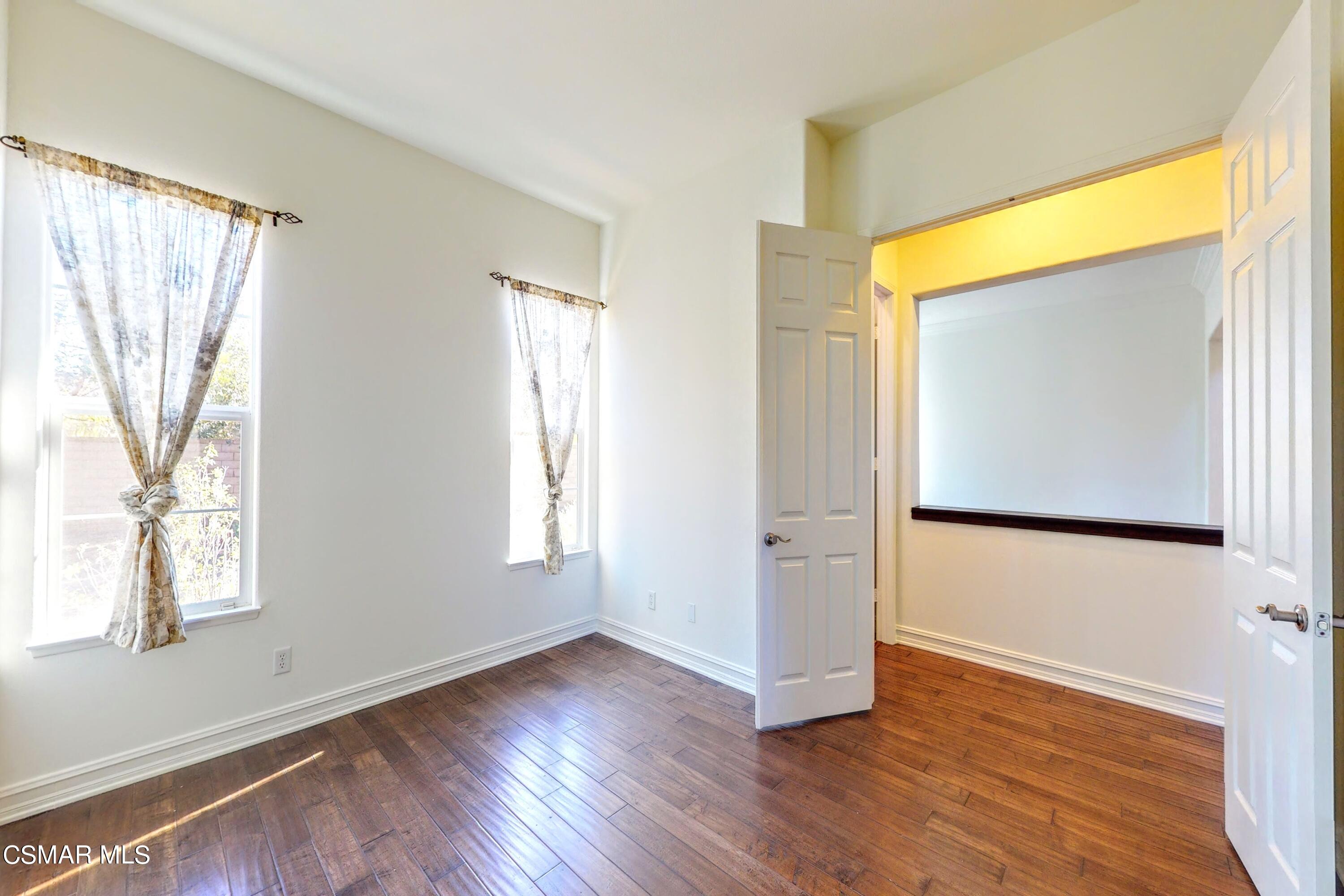 3705 Horizon Ridge Court Simi Valley, CA 93063 - Photo 34 of 62 a view of an empty room with wooden floor and a window