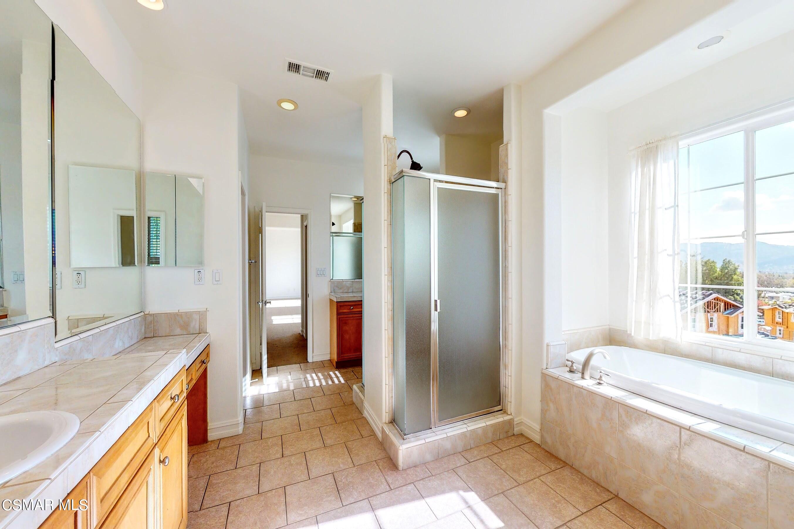 3705 Horizon Ridge Court Simi Valley, CA 93063 - Photo 45 of 62 a spacious bathroom with a tub shower and sink