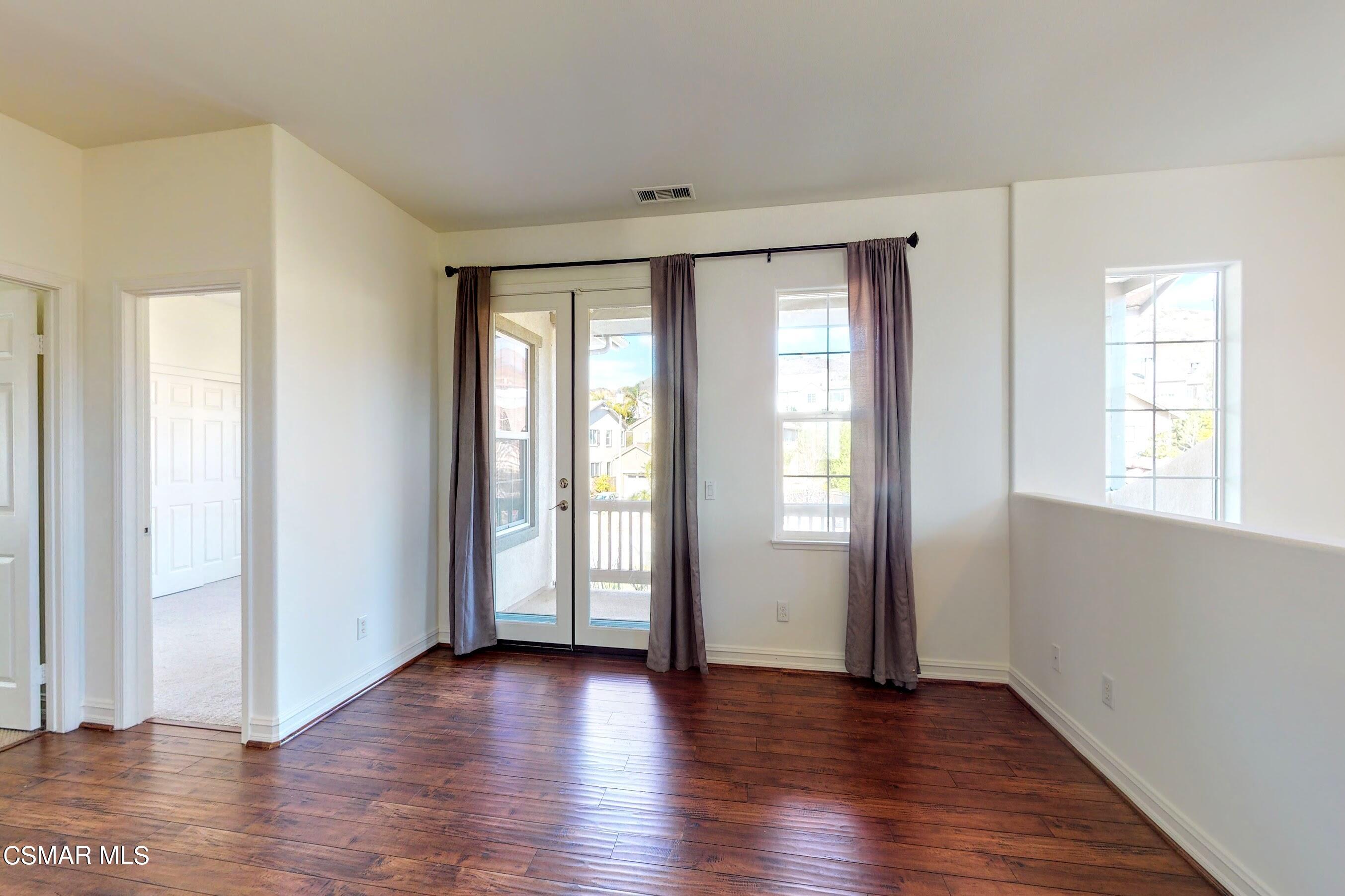 3705 Horizon Ridge Court Simi Valley, CA 93063 - Photo 48 of 62 an empty room with wooden floor and windows