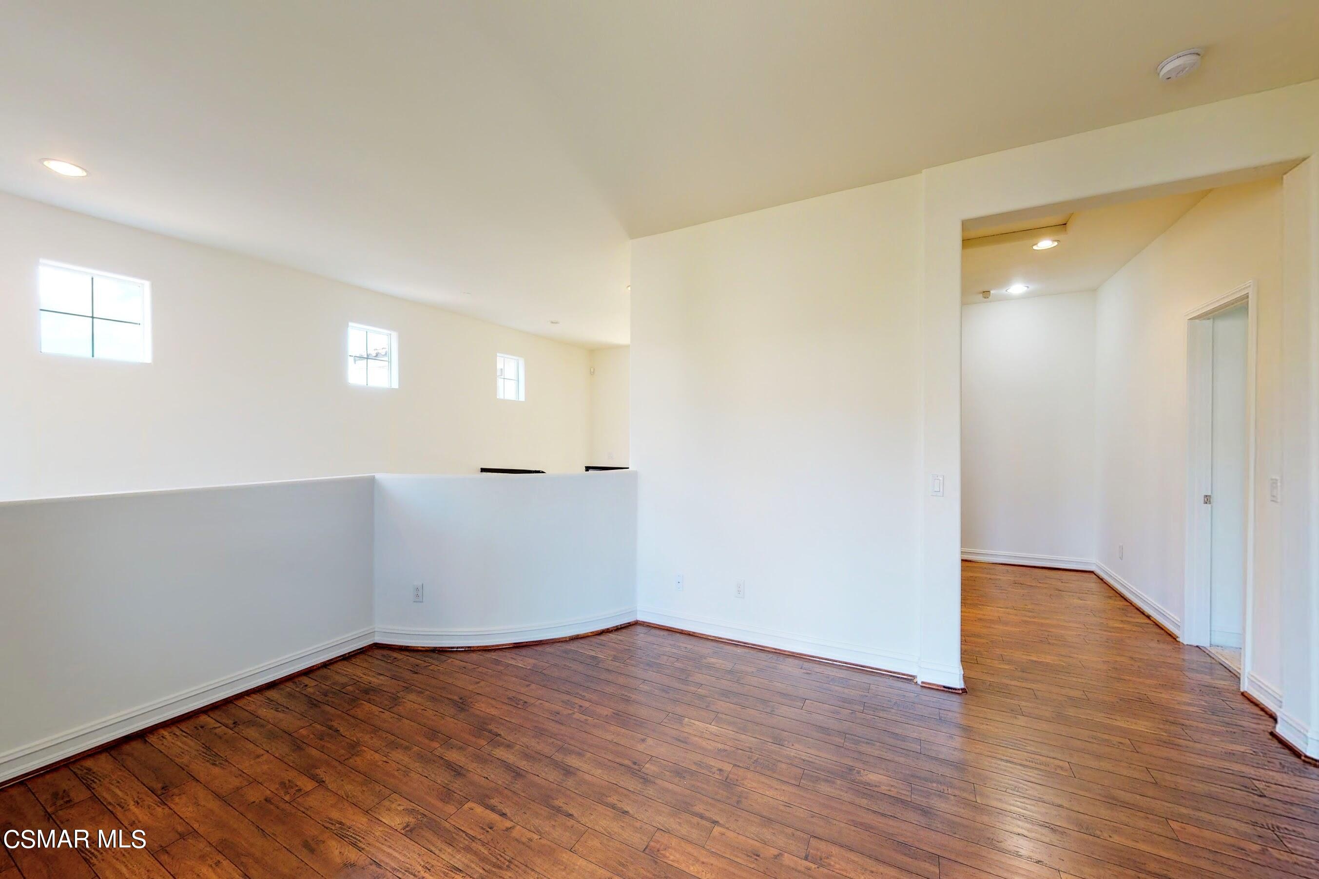 3705 Horizon Ridge Court Simi Valley, CA 93063 - Photo 49 of 62 a view of an empty room with wooden floor and a window
