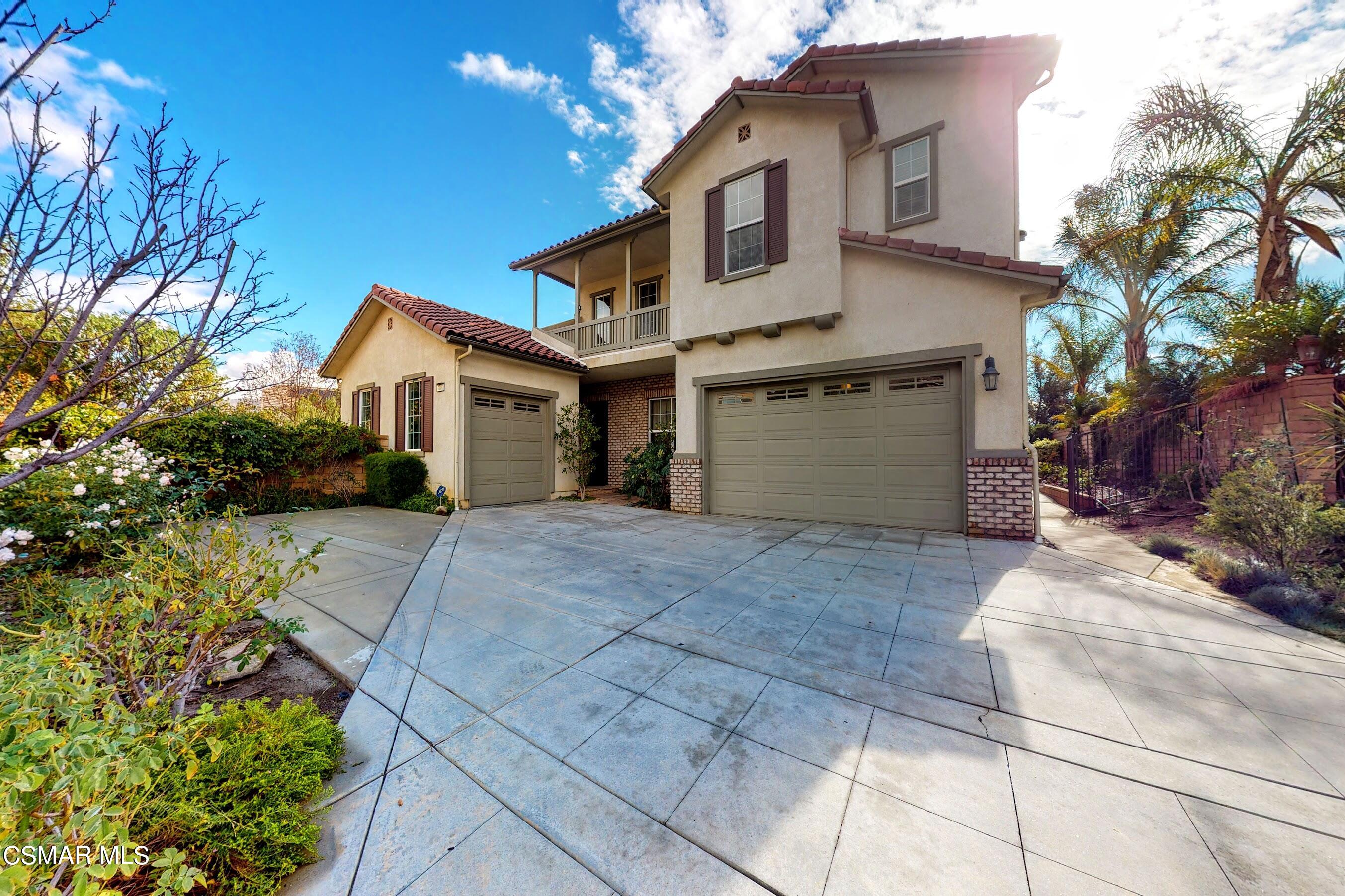 3705 Horizon Ridge Court Simi Valley, CA 93063 - Photo 61 of 62 a view of a white house with a yard and potted plants