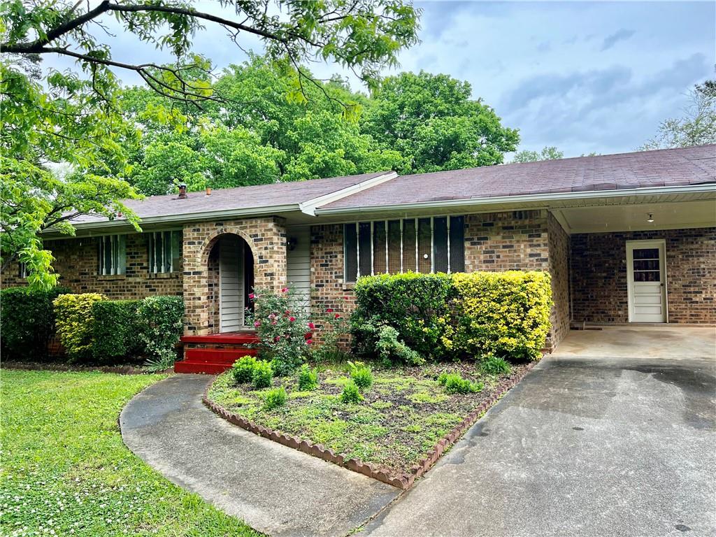 2072 Snapfinger Road Decatur, GA 30035 - Photo 1 of 1 a front view of a house with garden