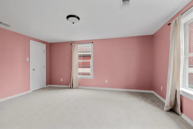 an empty room with windows