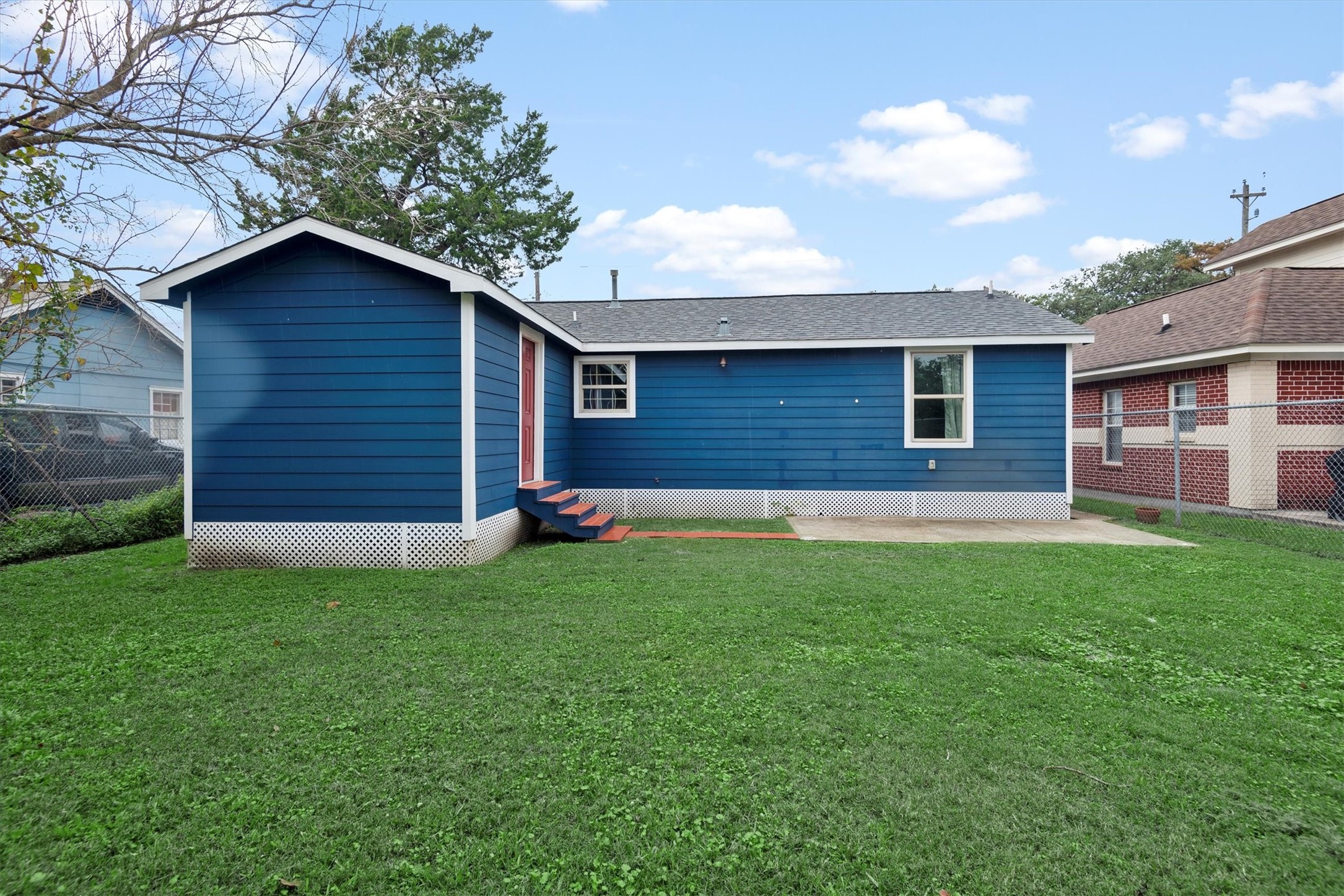 3914 Cetti Street Houston, TX 77009 - Photo 20 of 22 a brick house next to a yard with a large tree