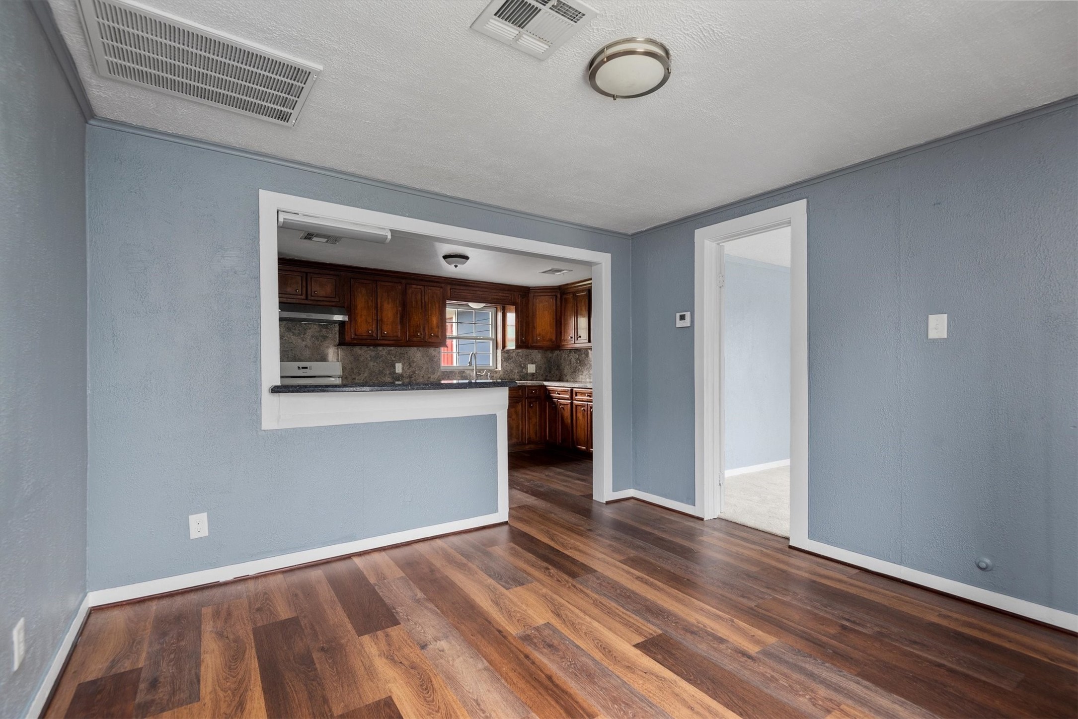 3914 Cetti Street Houston, TX 77009 - Photo 5 of 22 a view of a room with wooden floor and a window