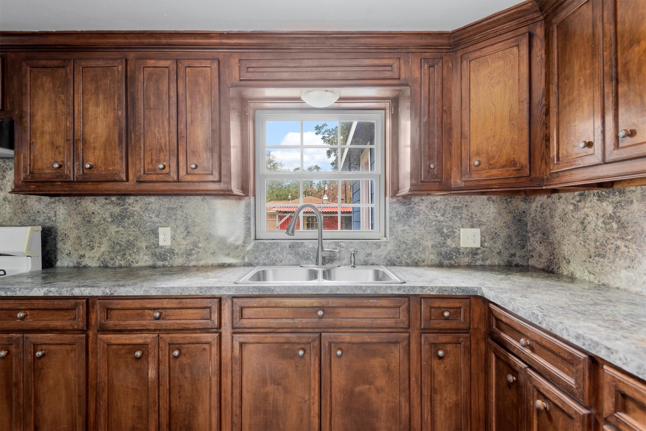 3914 Cetti Street Houston, TX 77009 - Photo 6 of 22 a kitchen with granite countertop stainless steel appliances granite countertop a sink and cabinets