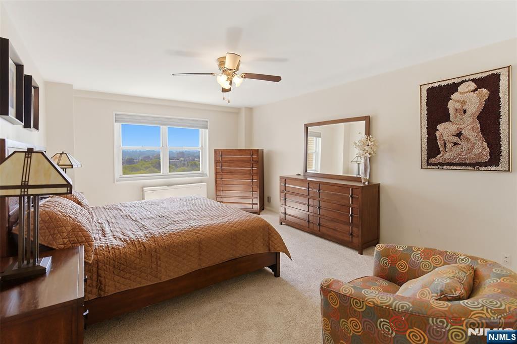 280 Prospect Avenue, Unit 8G Hackensack, NJ 07601 - Photo 17 of 23 a bedroom with a bed and furniture