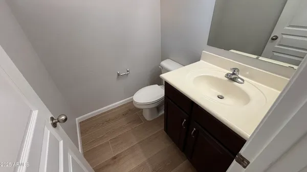 a bathroom with a sink toilet and vanity