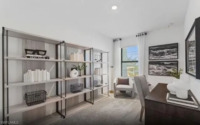 a living room with furniture a rug and a book shelf