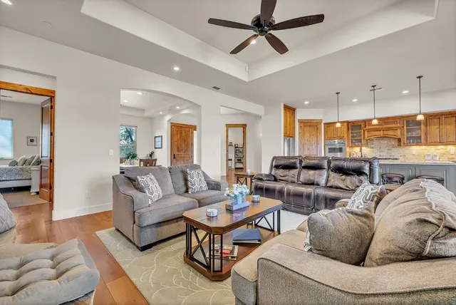 a view of a yard in front of a house with large tree