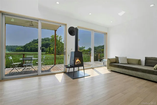 a view of a room with gym equipment and floor to ceiling window