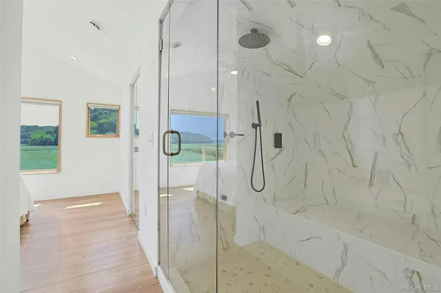 a bathroom with a glass shower door