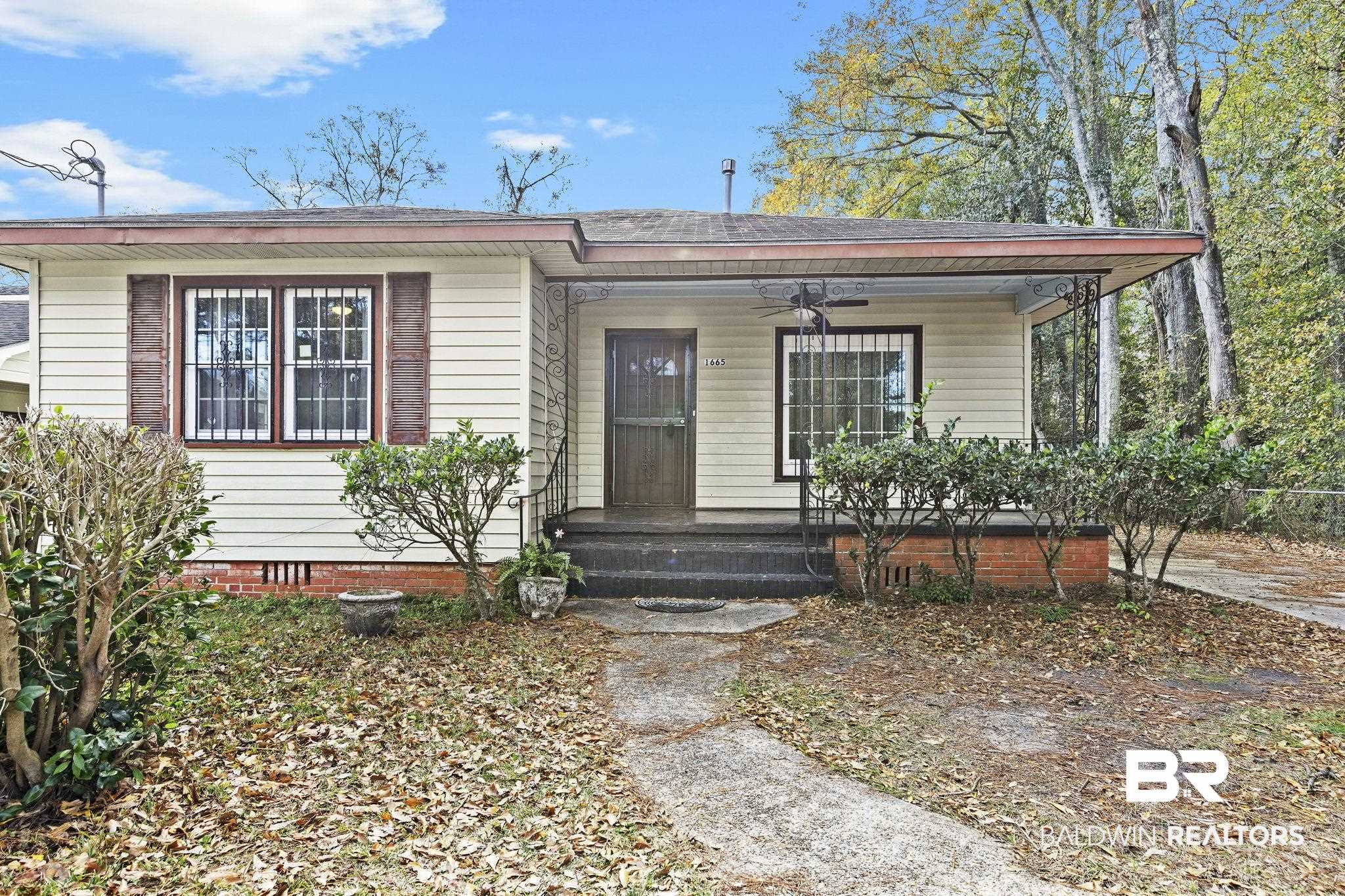 1665 Johnston Street Mobile, AL 36605 - Photo 1 of 17 View of front of property featuring ceiling fan and covered porch