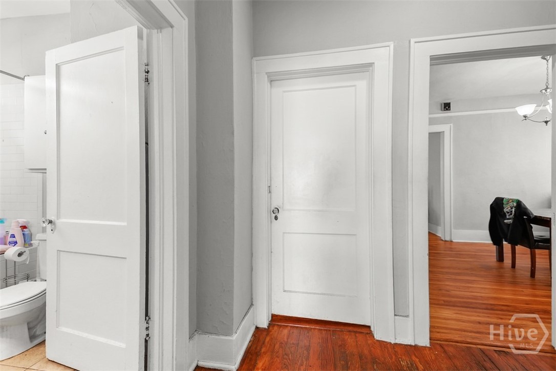 724 East 49th Street Savannah, GA 31405 - Photo 35 of 43 door to Bedroom 2, Unit B, day sleeper, bedroom leads to sunroom