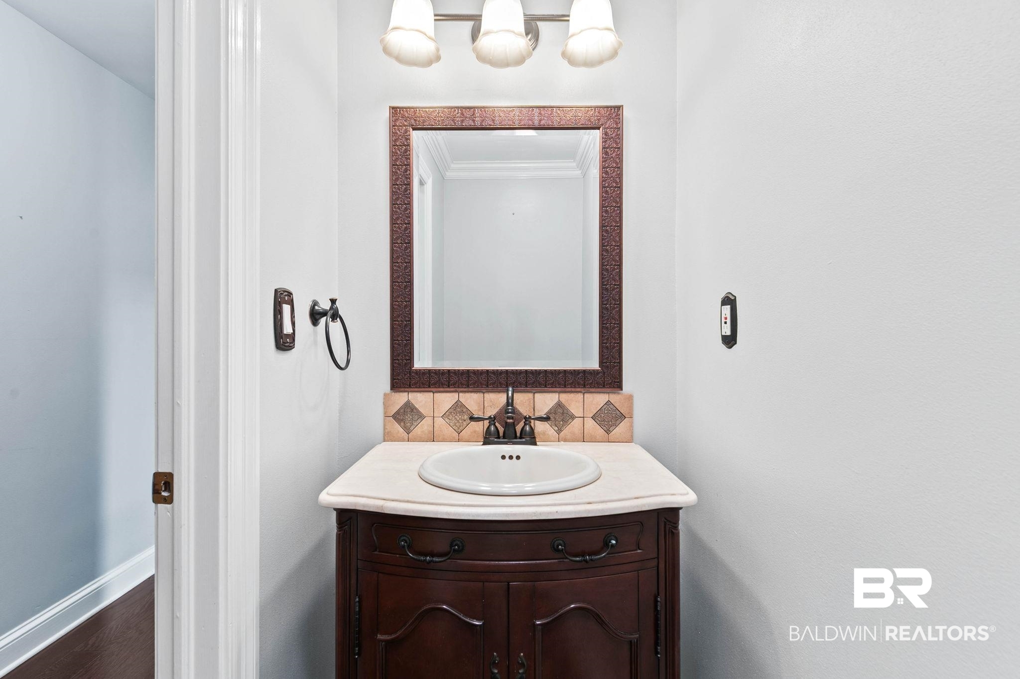 2 Speckle Trout Route Daphne, AL 36527 - Photo 23 of 61 Bathroom with vanity, tasteful backsplash, and crown molding