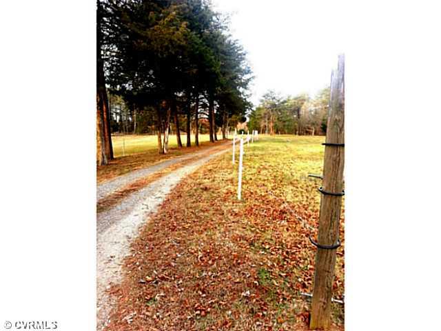Exterior Front - Hay Barn on the right.  2 Storage sheds.  3-Stall Barn to the left out of view.