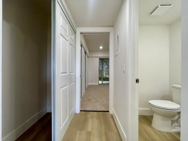 a view of a bathroom from a hallway