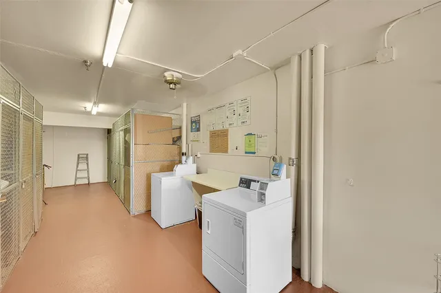 a swimming pool with outdoor seating and barbeque oven