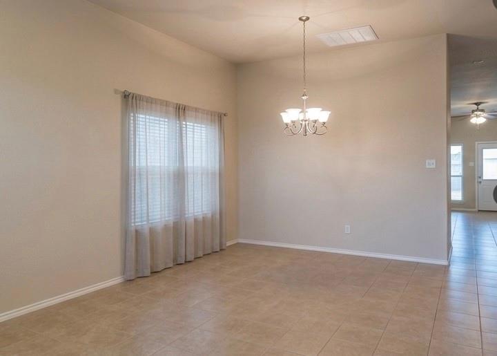 415 Harding Lane Lavon, TX 75166 - Photo 3 of 13 Spacious room featuring vaulted ceilings, neutral wall tones, and tiled flooring