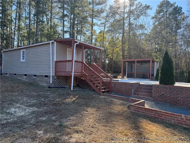 a view of a backyard of the house