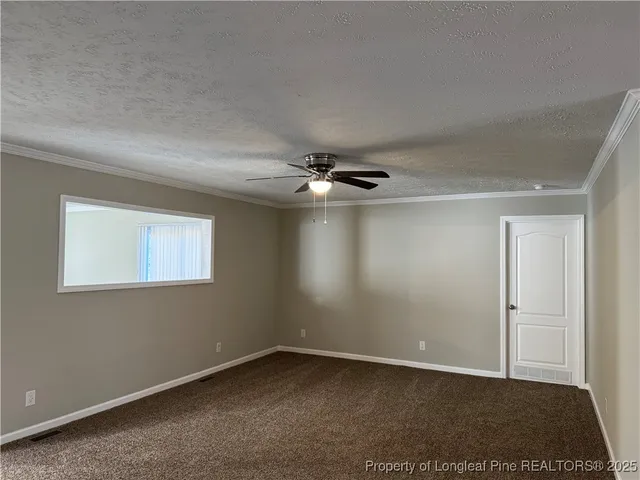 a kitchen with a sink a counter top space stainless steel appliances and cabinets