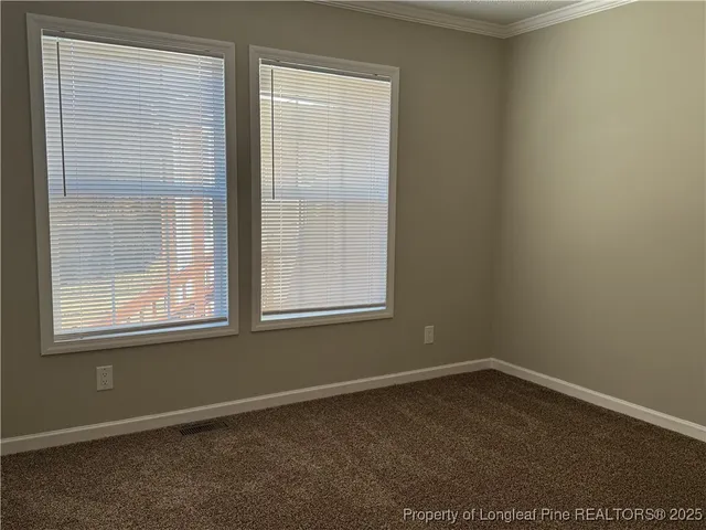 a bathroom with a granite countertop sink and a toilet