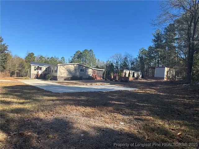a view of street with large trees