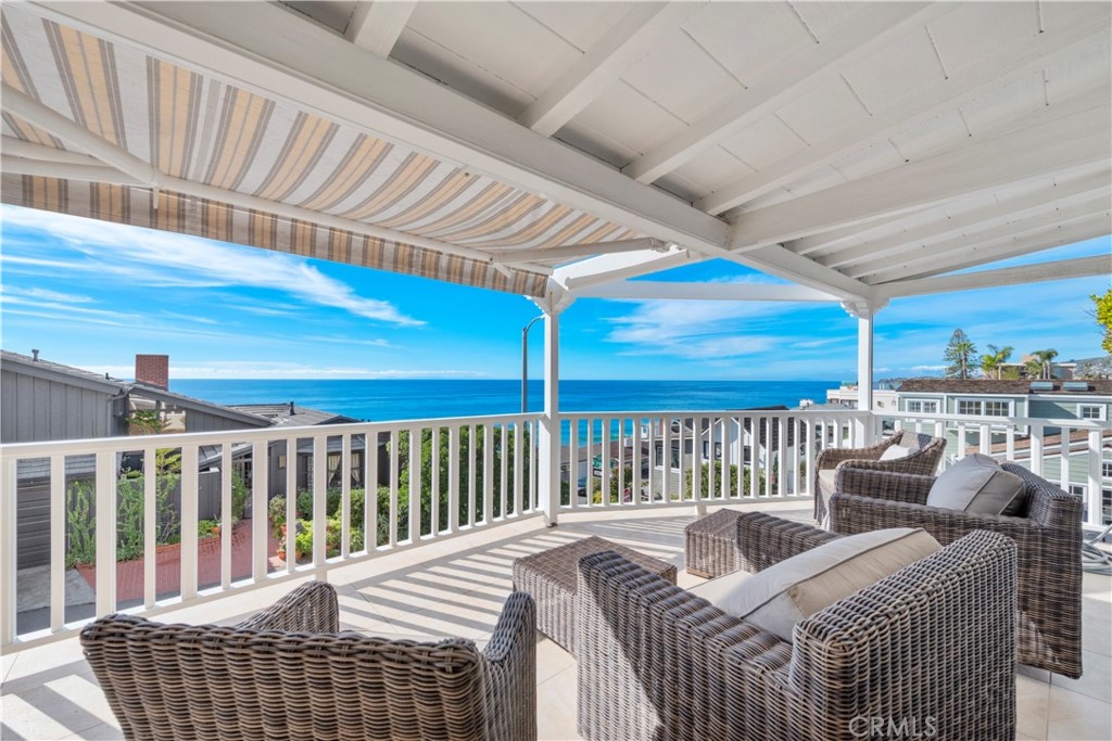 1810 Ocean Way Laguna Beach, CA 92651 - Photo 2 of 5 a bedroom with furniture and a large window