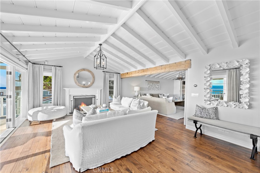 1810 Ocean Way Laguna Beach, CA 92651 - Photo 3 of 5 a living room with furniture and a clock