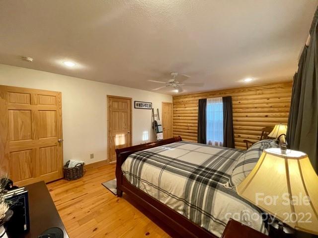 357 Cinnamon Ridge Rutherfordton, NC 28139 - Photo 11 of 40 a bedroom with a bed and wooden floor