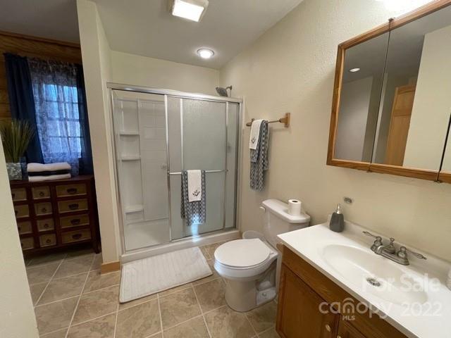 357 Cinnamon Ridge Rutherfordton, NC 28139 - Photo 17 of 40 a bathroom with a granite countertop sink toilet and shower