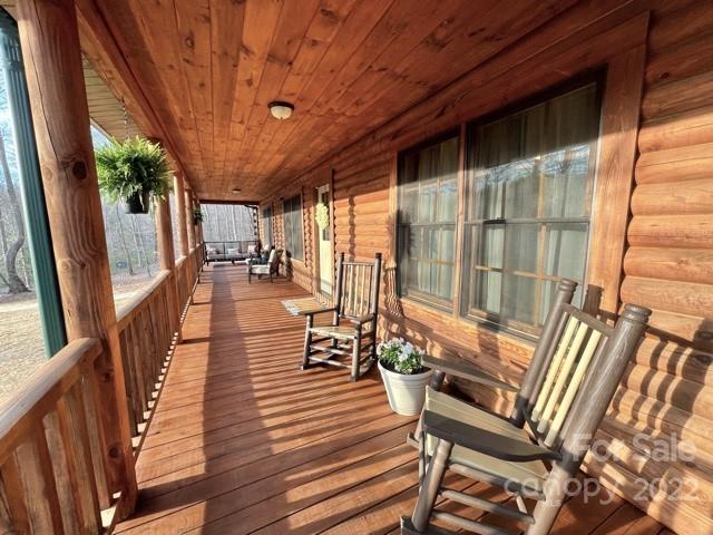 357 Cinnamon Ridge Rutherfordton, NC 28139 - Photo 2 of 40 a porch with seating space and hardwood floor