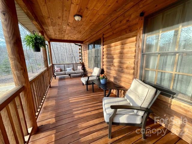 357 Cinnamon Ridge Rutherfordton, NC 28139 - Photo 25 of 40 a balcony with chairs and wooden floor