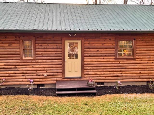 357 Cinnamon Ridge Rutherfordton, NC 28139 - Photo 32 of 40 a front view of a house with a garden