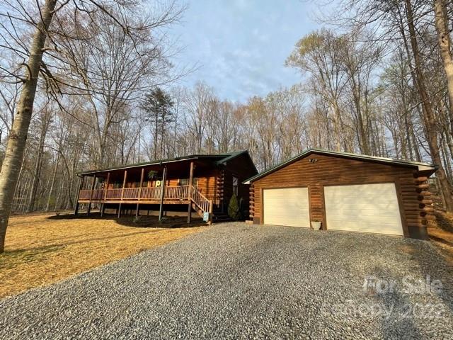 357 Cinnamon Ridge Rutherfordton, NC 28139 - Photo 36 of 40 a view of a house with a yard and garage